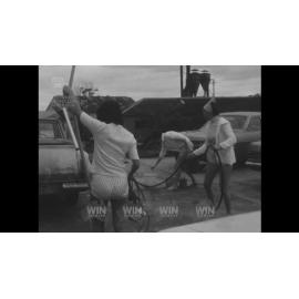 Miss Australia entrant doing car wash