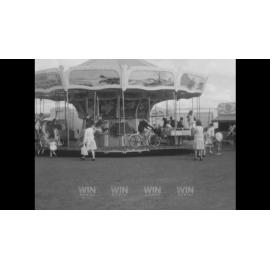 Carnival rides and harbouside children's activities