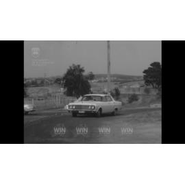 A distinguished lady arrives at Sirdar Wool in a car 