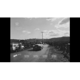 A car is wrecked by a train at a level crossing