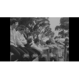 Sidecar and bike racing on a dirt track in Goulburn