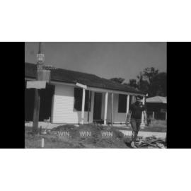 A firbreglass home swimming pool is craned into position