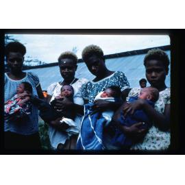 Tolai women and babies in western dress
