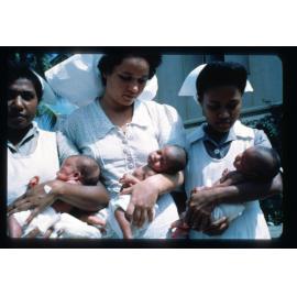 Papuan nurses with triplets