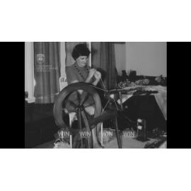 A spinning wheel in action and its products on display