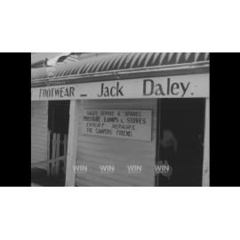 An old bootmaker's shop in Bateman's Bay is emptied of equipment and boxes by local Rotary Club members