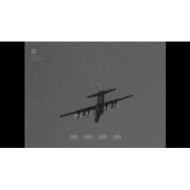 Soldiers unload military aeroplanes