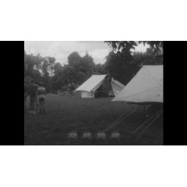 Boy Scouts making damper on a stick