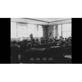 Phillip Baxter speaks at student in the Wollongong University College Common Room