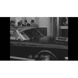 Men in suits arrive at the new Commonwealth Services building