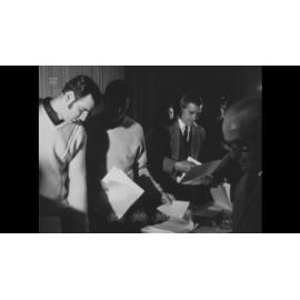 A meeting with paperwork collected