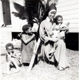 Sister of St Francis with children