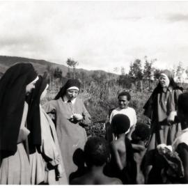 Sisters with Papuan people