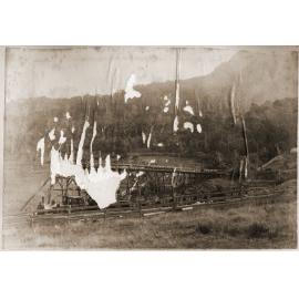 Steam engine pulling coal carts