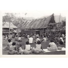 Village people listening to a Papua New Guinean Inspector