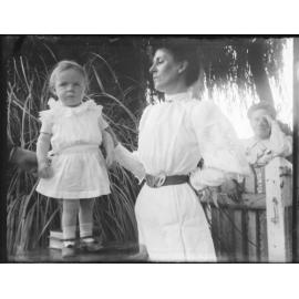 Portrait of child with onlookers